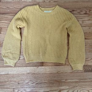 yellow knitted sweater
